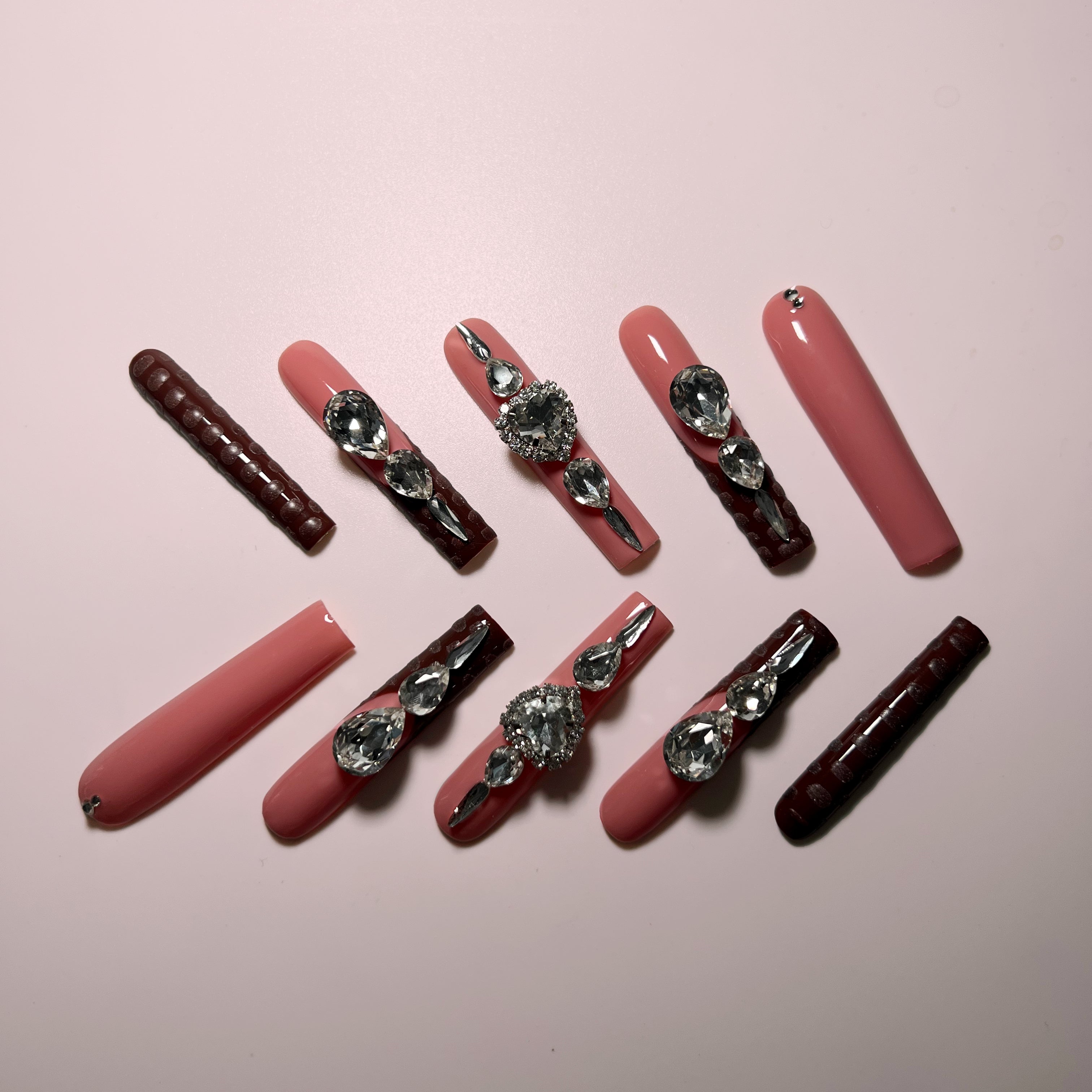 top view of Brown Sugar XXL coffin press-on nails in rich chocolate brown with rhinestone accents – elegant and long-lasting glam nails